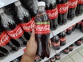 KULIM,MALAYSIA - CIRCA OCTOBER,2019 : A hand holding a bottle of Coca Cola stevia at supermarket