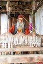 Kullu, Himachal Pradesh, India - August 09, 2018 : An Indian old man makes a traditional sadu weaving