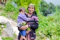 Kullu, Himachal Pradesh, India - August 31, 2018 : Photo of beautiful Indian himalayan Traditional woman with kid