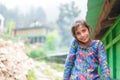 Kullu, Himachal Pradesh, India - August 31, 2018 : Portrait of himachali girl near her house in himalayas Royalty Free Stock Photo