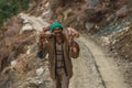 Kullu, Himachal Pradesh, India - February 01, 2019 : Unidentified himachali old man Man Carrying Wood in Himalayas India Royalty Free Stock Photo