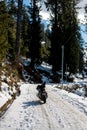 Bike on snow covered road in mountains