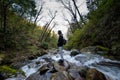 Kullu, Himachal Pradesh, India - March 01, 2019 - Traveller at milky water stream in himalayas - waterfall