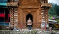 Kullu, Himachal Pradesh, India - September 01, 2018 : himachali old man at temple on the street in Himalayan village Royalty Free Stock Photo