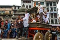 The Kumari, or living Goddess, is pulled through the crowd at In