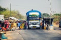 People, street vendors selling goods to passing traffic