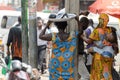 Unidentified Ghanaian woman carries a basin at the Kumasi marke