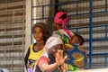 Unidentified Ghanaian woman waves her hand at the Kumasi market