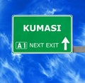 KUMASI road sign against clear blue sky