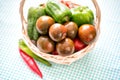 Kumato (brown) tomatoes in basket, closeup Royalty Free Stock Photo