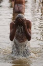 Sadu pilgrim purifing in the holi ganages river Royalty Free Stock Photo