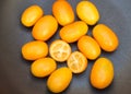 Kumquat fruits (or cumquats) citric fruit on a cup of glass.