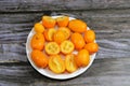 Kumquats, cumquats, a group of small, angiosperm, fruit-bearing trees in the family Rutaceae, golden orange, an edible fruit Royalty Free Stock Photo