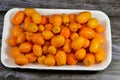 Kumquats, cumquats, a group of small, angiosperm, fruit-bearing trees in the family Rutaceae, golden orange, an edible fruit Royalty Free Stock Photo