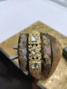 Kundan jewellery art work on gold kada bangles