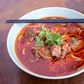 Kung fu noodles like spicy noodle with beef, vegetables and chinese sauce, Chinese traditional cuisine