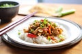 kung pao chicken over white rice on a plate Royalty Free Stock Photo