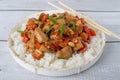 Kung Pao Chicken in white plate on Wood Background Royalty Free Stock Photo