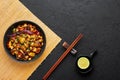 Kung Pao Paneer at black slate background. Kung Pao Paneer is a vegetarian version of chinese dish Gong Bao. Indian Food