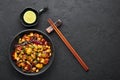 Kung Pao Paneer at black slate background. Kung Pao Paneer is a vegetarian version of chinese dish Gong Bao. Indian Food