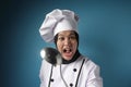 Kungfu Chef, Woman Chef Holding Ladle and Spatula, Ready to Cook Royalty Free Stock Photo