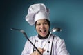 Kungfu Chef, Woman Chef Holding Ladle and Spatula, Ready to Cook Royalty Free Stock Photo