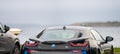 Black 2016 BMW i8 hybrid electric car at a parking lot..