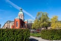 Kungstradgarden is famous landmark in Stockholm. Church of St. James. Landscaped park with smooth green bushes and ornamental Royalty Free Stock Photo