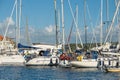 Marina filled with sailboats and cabin cruisers..