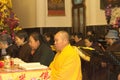 A buddhist monk with a yellow robe is praying in Yuantong Temple Royalty Free Stock Photo