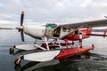 Kununurra, WA. Australia - May 18, 2013: A Cessna 208 Caravan Amphibious Float plane lands on the still waters of Lake Argyle