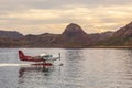 Kununurra, WA. Australia - May 18, 2013: A Cessna 208 Caravan Amphibious Float plane lands on the still waters of Lake Argyle