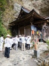 KuO-henro pilgrims reading sutras at Iwayaji, temple number 45 of Shikoku pilgrimage Royalty Free Stock Photo