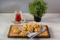 kurabiye cookies with jam on a wooden table with a Turkish cup of tea Royalty Free Stock Photo