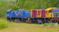 Two diesel locomotives pulling passenger train