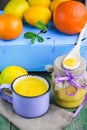 Kurd. Lemon custard and fresh lemons, oranges and mint on old wooden table.