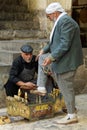 Kurdish bootblack polishes of an old Kurdish man