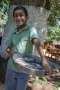 A Kurdish boy with fish food in Urfa.