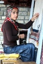 A Kurdish lady making a carpet in Van in eastern Turkey.