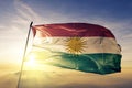 Kurdistan flag textile cloth fabric waving on the top sunrise mist fog Royalty Free Stock Photo