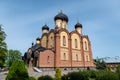 KUREMAE, IDA-VIRUMAA COUNTY, ESTONIA - JUNE 5, 2022: Church of St Arsinius and St Nicholas on the monastery cemetery. Puhtitsa