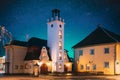 Kuressaare, Estonia. Close-up View Of Building Of Fire Bell Tower And Town Hall In Evening Illuminations. Amazing Bold Royalty Free Stock Photo