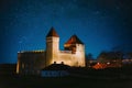 Kuressaare, Saaremaa Island, Estonia. Amazing Starry Sky Above Episcopal Castle In Night Time. Traditional Medieval