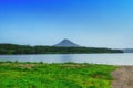 Kurile lake. Kamchatka. Russia. Green fields and volcanoes. Wild nature