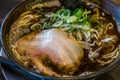 Kuro tonkotsu ramen with chashu pork and bean sprout.