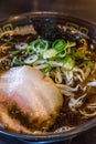 Kuro tonkotsu ramen with chashu pork and bean sprout.