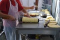 Kurtos kalacs or chimney cakes, preparing on charcoal grill, street food traditional Hungarian