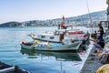 Kusadasi, Turkey, 05/19/2019: Fishermen in the port catch fish