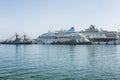 Kusadasi, Turkey, 05/19/2019: Large beautiful cruise ships stand in the port. Turquoise sea and clear blue sky on a sunny day.