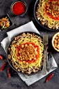 Kushari or Koushari - Egyptian dish of lentils, rice, pasta, chickpeas with tomato sauce and crispy onions. Arabic cuisine